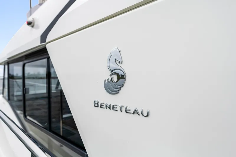 Slide: The Image of 2018 Beneteau Swift Trawler 30 logo on sleek white exterior. - 8