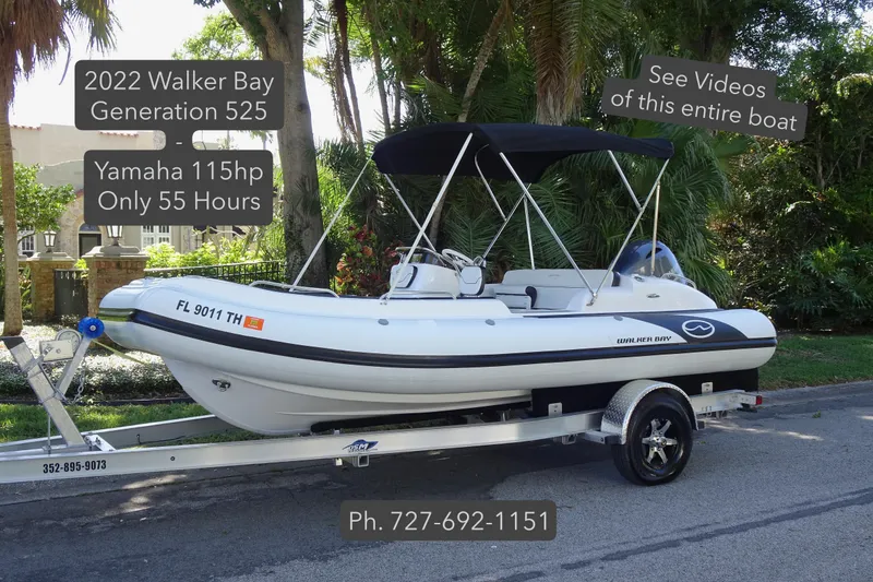 The Image of 2022 Walker Bay Generation 525 boat with Yamaha 115hp engine on trailer, outdoor setting. - 0