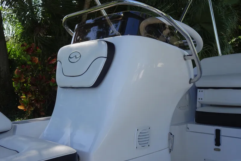 Slide: The Image of 2022 Walker Bay Generation 525 boat console with sleek design and comfortable seating. - 12