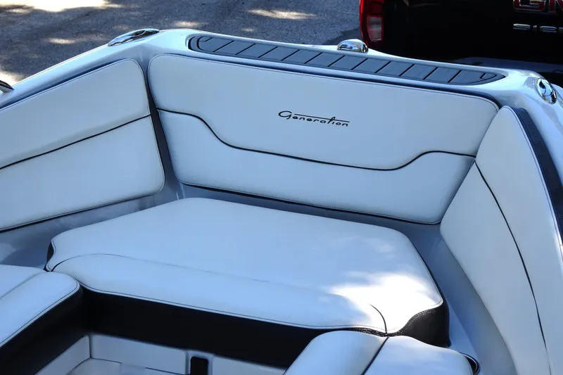 Slide: The Image of 2022 Walker Bay Generation 525 boat interior with white cushioned seating. - 13