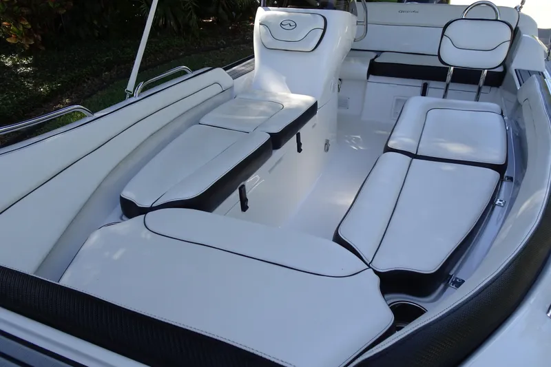 Slide: The Image of 2022 Walker Bay Generation 525 boat interior with white cushioned seating and sleek design. - 15