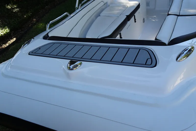 Slide: The Image of 2022 Walker Bay Generation 525 boat interior with sleek white seating and modern design. - 16