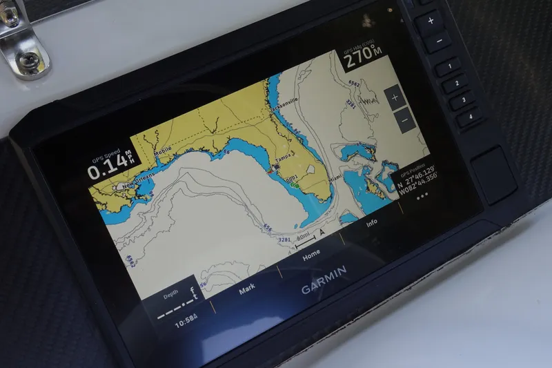 Slide: The Image of Garmin GPS display on 2022 Walker Bay Generation 525, showing nautical map and coordinates. - 21