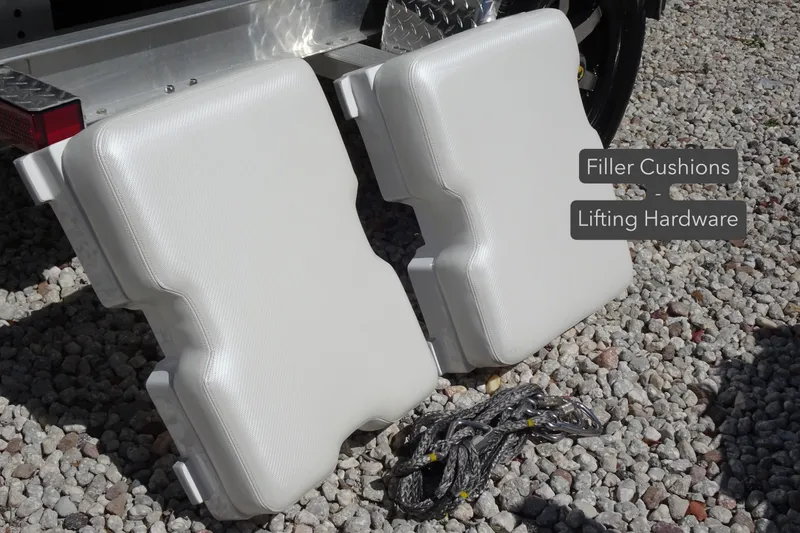 Slide: The Image of Filler cushions and lifting hardware for 2022 Walker Bay Generation 525 on gravel surface. - 25
