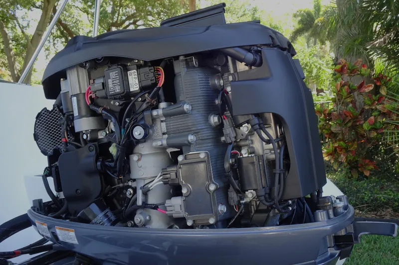 Slide: The Image of 2022 Walker Bay Generation 525 engine, detailed view with surrounding greenery. - 26