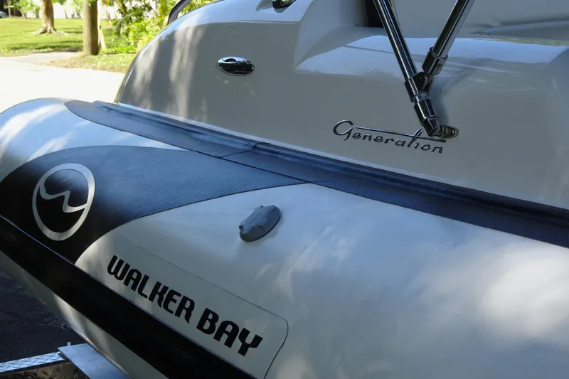 Slide: The Image of 2022 Walker Bay Generation 525 boat, close-up of branding and design details. - 5