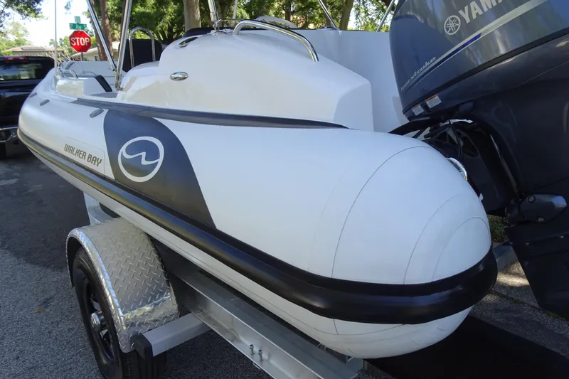 Slide: The Image of 2022 Walker Bay Generation 525 boat on trailer with Yamaha outboard motor. - 8