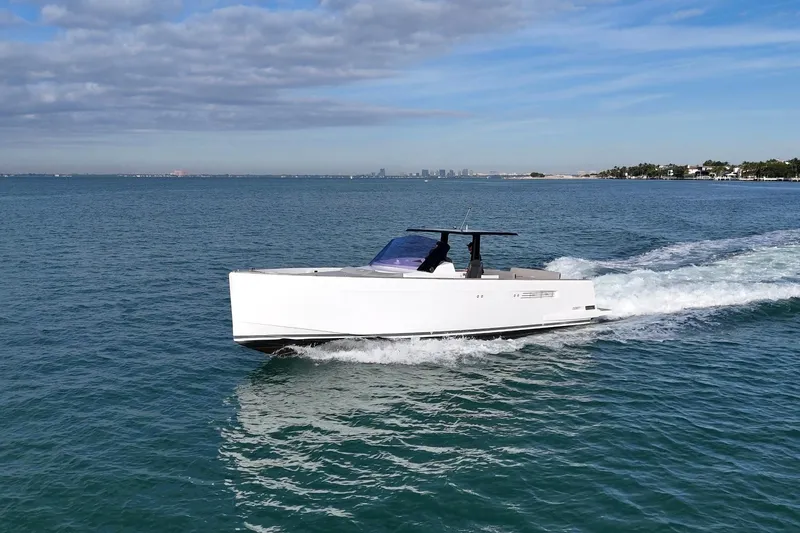 Slide: The Image of 2019 Fjord 40' Open yacht cruising on open water under a partly cloudy sky. - 12