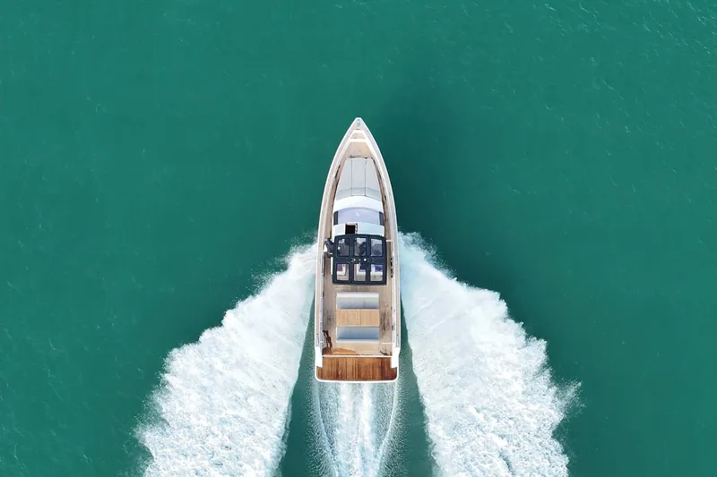 Slide: The Image of 2019 Fjord 40' Open yacht cruising on open water with city skyline in background. - 15