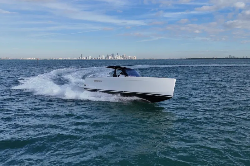 Slide: The Image of 2019 Fjord 40' Open yacht cruising on calm blue waters under a partly cloudy sky. - 17