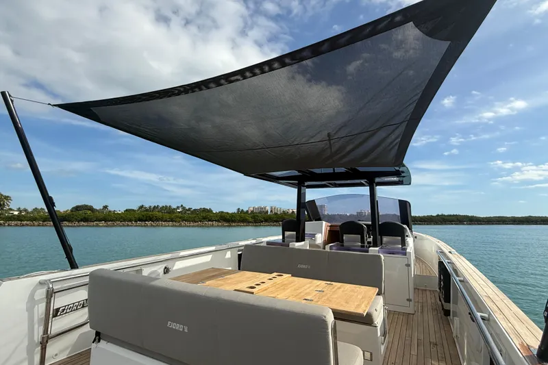 Slide: The Image of 2019 Fjord 40' Open yacht deck with wooden flooring and rope storage. - 30