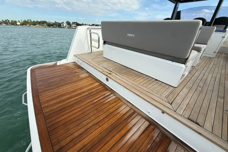 Slide: The Image of 2019 Fjord 40' Open yacht with sleek seating and modern design on a sunny day. - 32