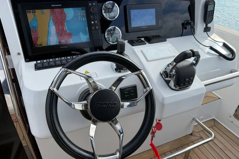 Slide: The Image of Helm of 2019 Fjord 40' Open yacht with dual seats and navigation controls. - 39
