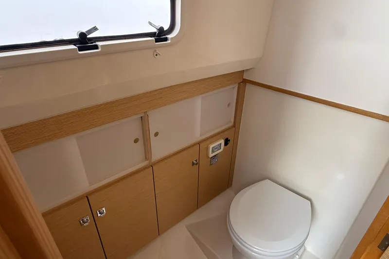 Slide: The Image of Luxurious interior of 2019 Fjord 40' Open yacht with wooden cabinetry and bed. - 43