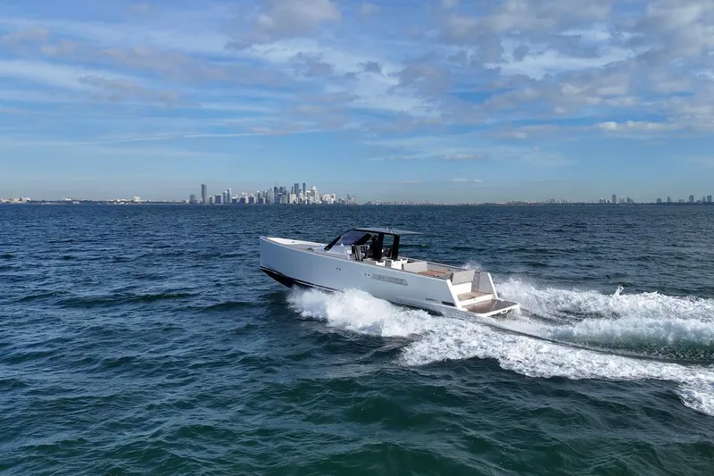 Slide: The Image of 2019 Fjord 40' Open yacht cruising on ocean with city skyline in background. - 9