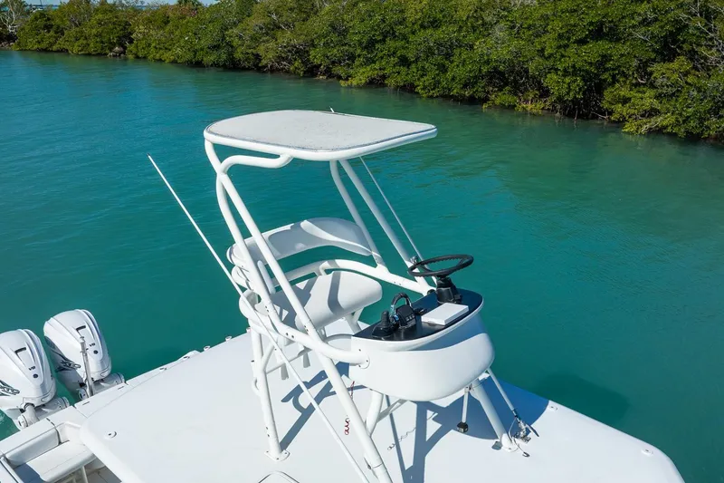 Slide: The Image of 2019 Jupiter 38 HFS boat with elevated helm, cruising on turquoise water. - 15