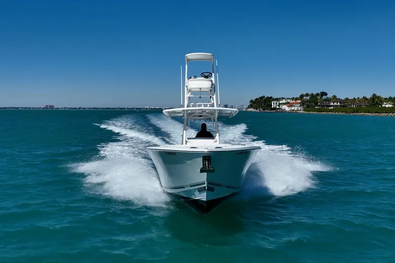 Slide: The Image of 2019 Jupiter 38 HFS boat cruising on clear blue water under a sunny sky. - 2
