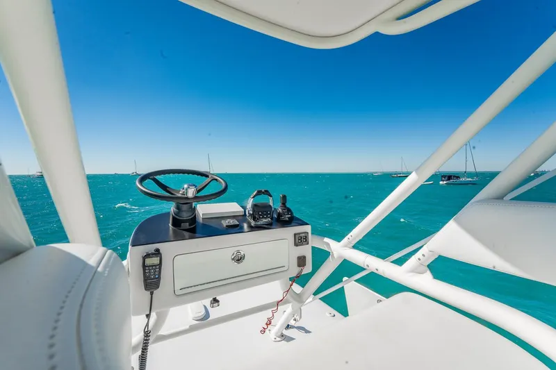 Slide: The Image of Helm of 2019 Jupiter 38 HFS boat with ocean view and clear blue sky. - 22