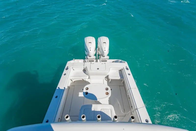 Slide: The Image of 2019 Jupiter 38 HFS boat with dual engines on turquoise water. - 25