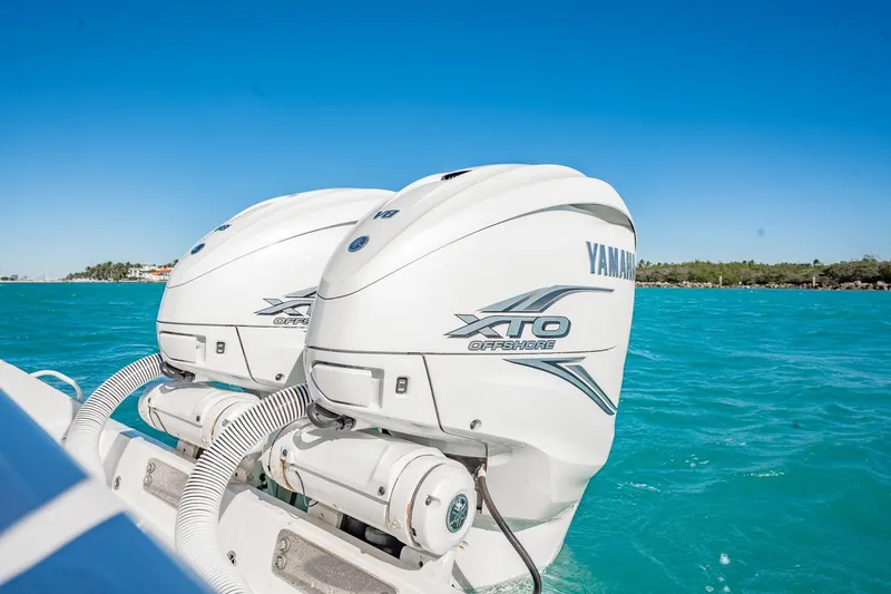 Slide: The Image of 2019 Jupiter 38 HFS boat with Yamaha XTO Offshore engines on turquoise water. - 37