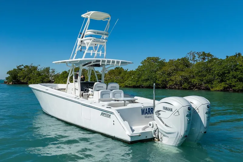 Slide: The Image of 2019 Jupiter 38 HFS boat with dual Yamaha engines on clear water. - 4