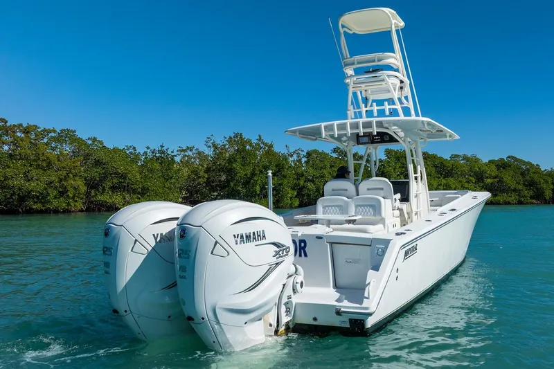 Slide: The Image of 2019 Jupiter 38 HFS boat with twin Yamaha engines on clear water. - 40