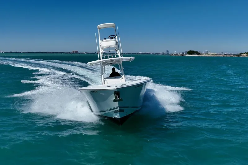 Slide: The Image of 2019 Jupiter 38 HFS boat cruising on clear blue water under a sunny sky. - 44
