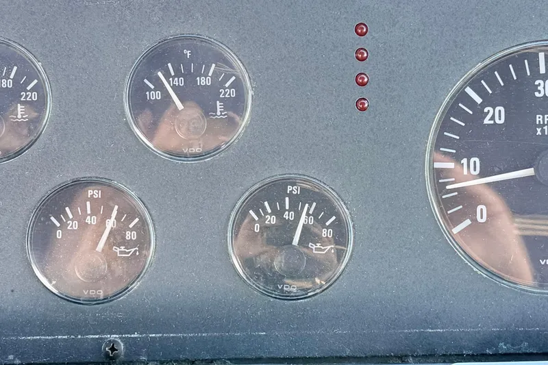 Slide: The Image of Dashboard gauges of a 1997 Tiara 3100 Open Express boat. - 10
