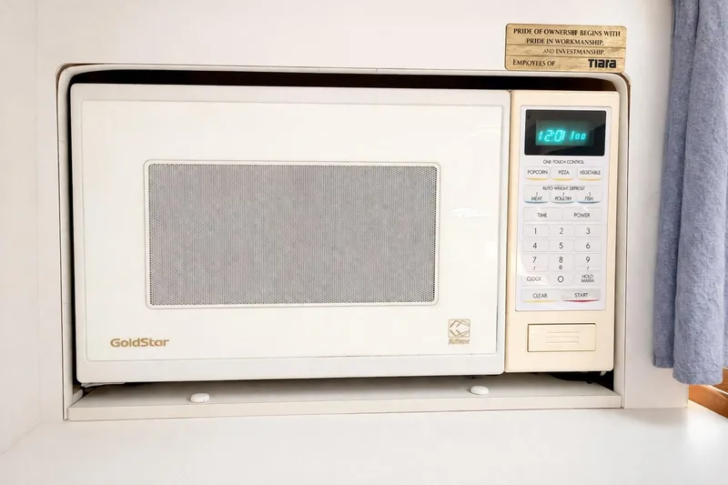 Slide: The Image of Built-in GoldStar microwave in a 1997 Tiara 3100 Open Express boat kitchen. - 22