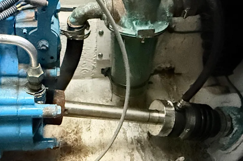 Slide: The Image of Engine compartment of a 1997 Tiara 3100 Open Express boat, showing mechanical components. - 29