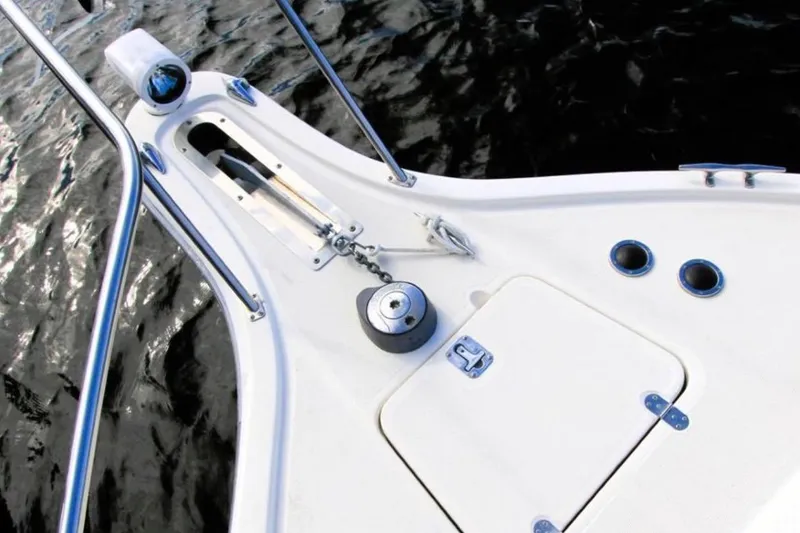 Slide: The Image of Bow of a 1997 Tiara 3100 Open Express boat with anchor and hatch details. - 6
