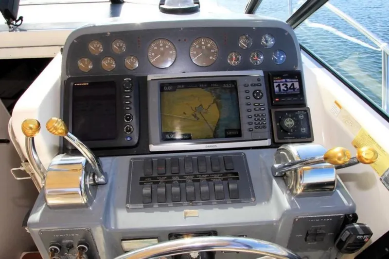 Slide: The Image of Control panel of a 1997 Tiara 3100 Open Express boat with navigation instruments. - 7