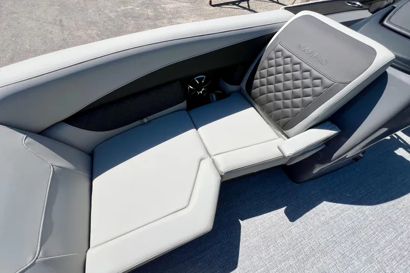 Slide: The Image of Luxurious seating on 2026 Harris Sunliner 210 boat, featuring quilted upholstery. - 11