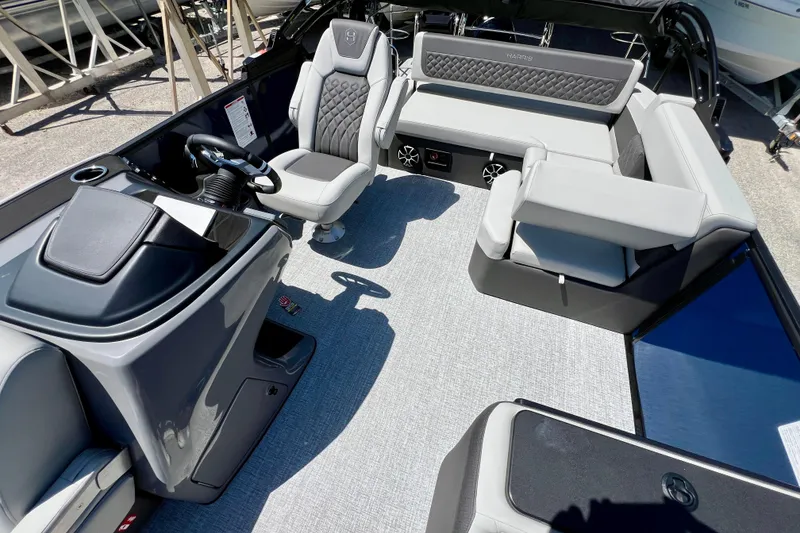 Slide: The Image of 2026 Harris Sunliner 210 boat interior with modern seating and sleek design. - 12