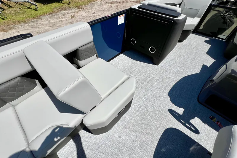 Slide: The Image of 2026 Harris Sunliner 210 interior with modern seating and sleek design. - 13