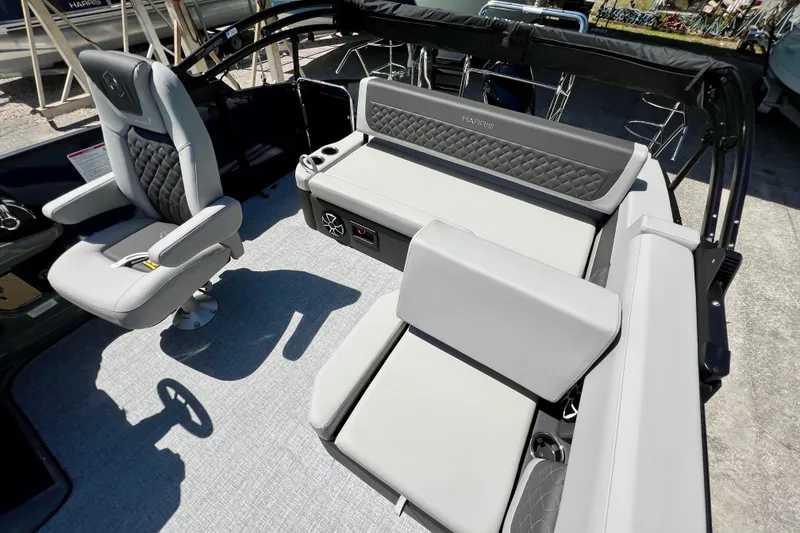 Slide: The Image of 2026 Harris Sunliner 210 boat interior with plush seating and modern design. - 17