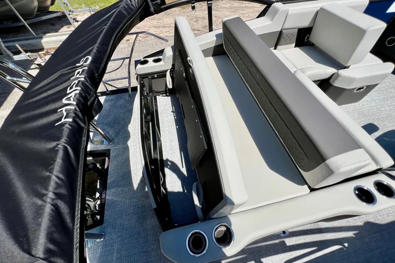 Slide: The Image of 2026 Harris Sunliner 210 boat interior with sleek seating and cup holders. - 22
