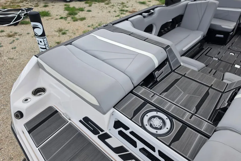 Slide: The Image of 2023 Supra SL 450 boat interior with sleek gray seating and modern design elements. - 10