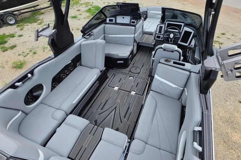 Slide: The Image of 2023 Supra SL 450 boat interior with luxurious seating and modern dashboard design. - 13
