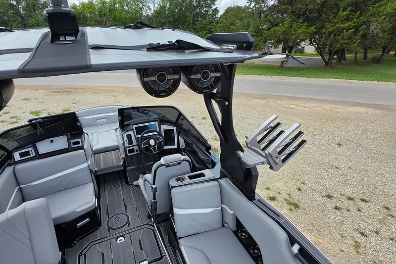 Slide: The Image of 2023 Supra SL 450 boat interior with sleek design, advanced controls, and premium seating. - 16
