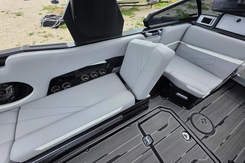 Slide: The Image of 2023 Supra SL 450 boat interior with sleek gray seating and modern design elements. - 18