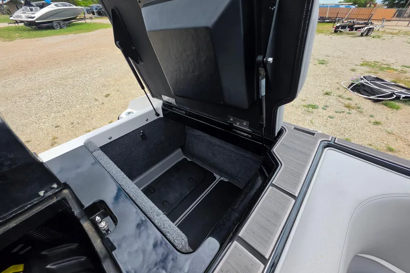 Slide: The Image of Open storage compartment in 2023 Supra SL 450 boat, showcasing interior space and design. - 32