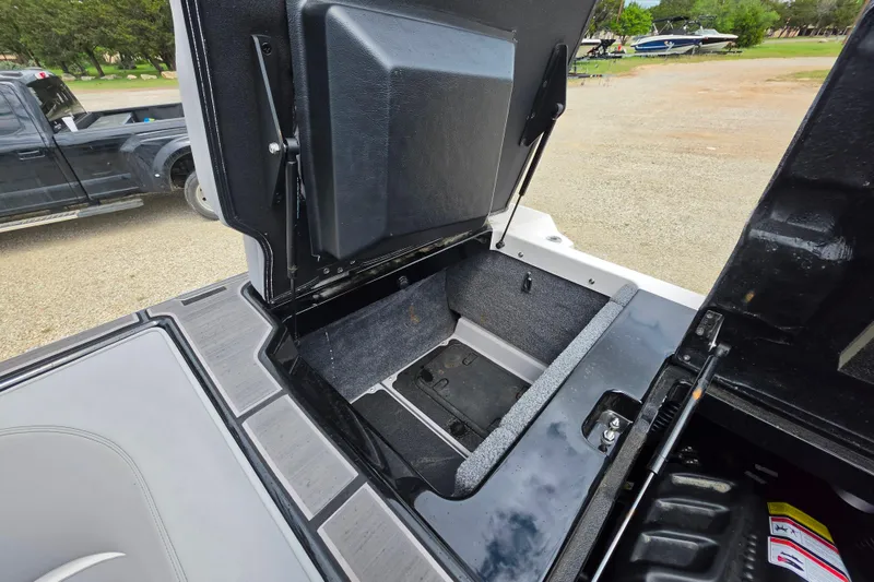 Slide: The Image of Open storage compartment in 2023 Supra SL 450 boat, showcasing interior space and design. - 33