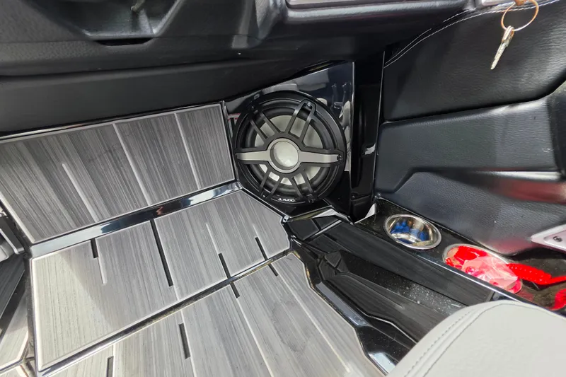 Slide: The Image of 2023 Supra SL 450 interior with sleek flooring and premium audio speaker system. - 34