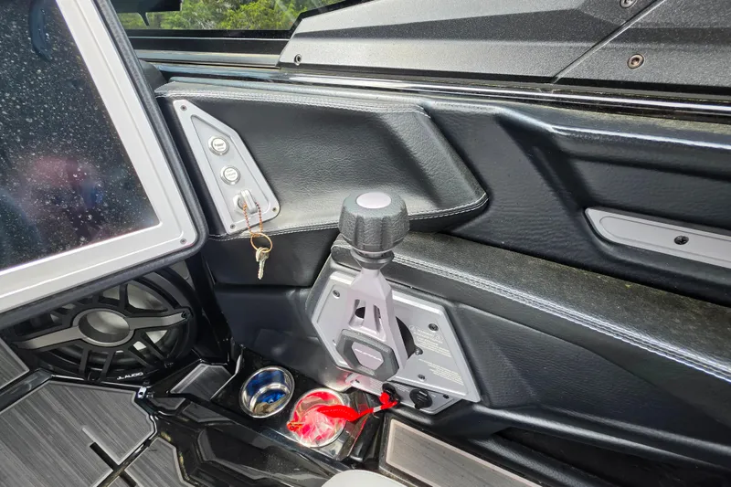 Slide: The Image of Interior of 2023 Supra SL 450 boat with control panel and speaker system. - 35
