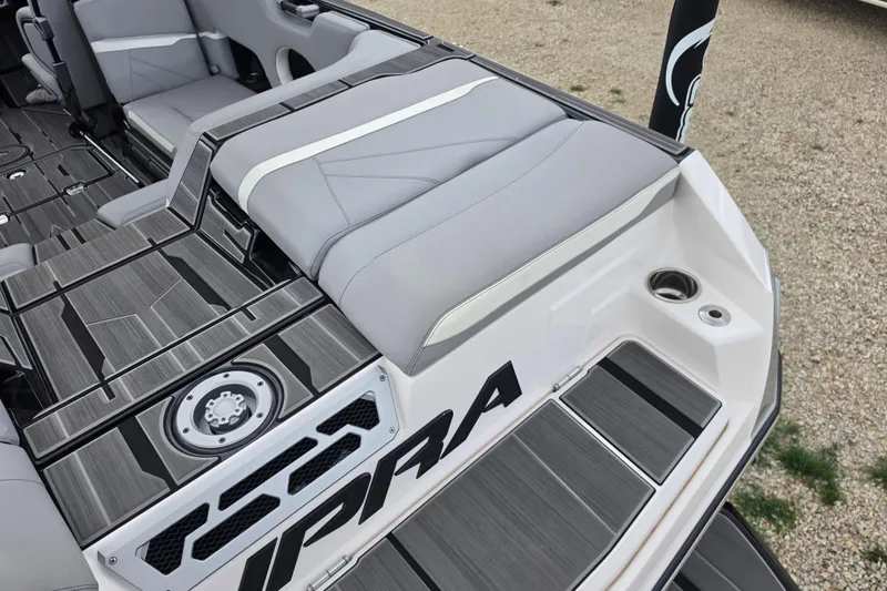 Slide: The Image of 2023 Supra SL 450 boat interior with sleek gray seating and modern design. - 9