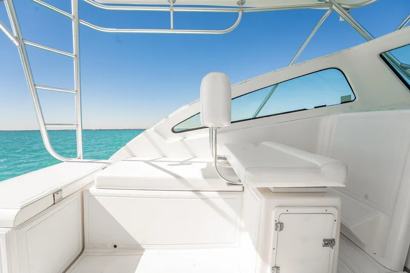 Slide: The Image of 2004 Luhrs Tournament 320 Open boat interior with white seating and ocean view. - 25