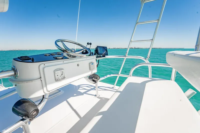 Slide: The Image of 2004 Luhrs Tournament 320 Open helm with ocean view and clear blue sky. - 30