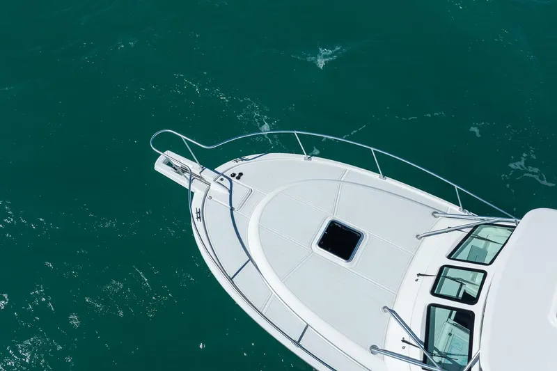 Slide: The Image of Aerial view of 2004 Luhrs Tournament 320 Open boat on turquoise water. - 47