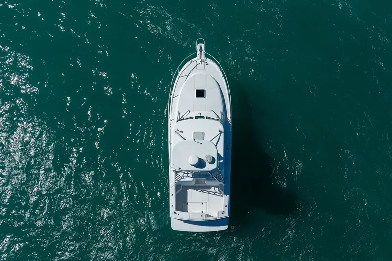 Slide: The Image of Aerial view of 2004 Luhrs Tournament 320 Open boat on turquoise water. - 48